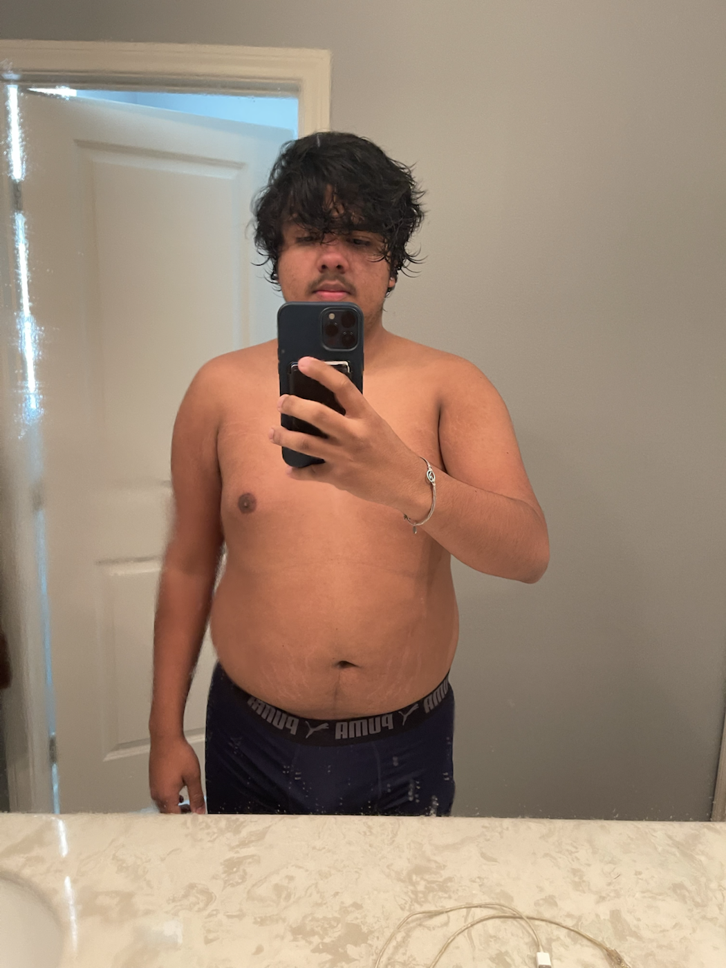 Alex before transformation mirror photo